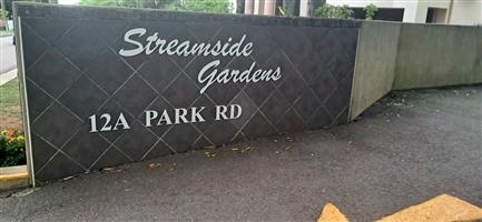 Renovated 2-Bedroom Simplex in Secure Streamside Gardens—Modern Upgrades, Study, Deck & Garage with