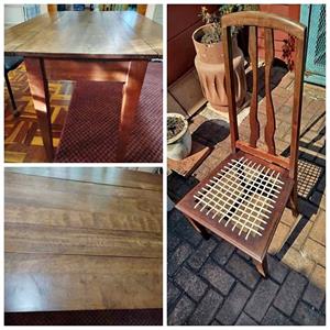 Antique Rhodesian Kiaat dining table and four matching riempie chairs