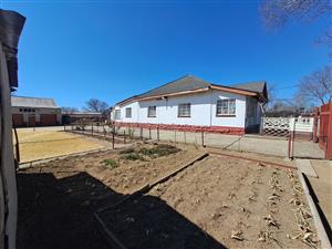 Charming Property with Lush Vegetable Gardens and a Thriving Orchard for Sale