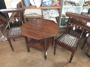 Unusual, octagonal, occasional table with casters and bottom shelf