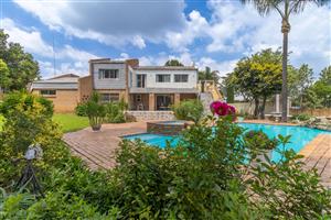 Your forever home is a private retreat in a lush, green oasis!