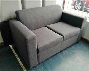 Dark grey two seater couch