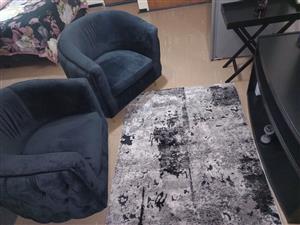 Two black single couches for sale