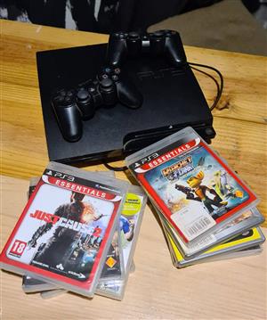 Playstation 3 with 2 controllers and games