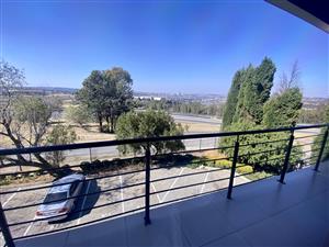 Fully fitted double-volume light space with views of the racetrack.