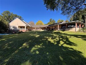 Elegant Garden Home with Income-Generating Cottages and Entertainment Spaces