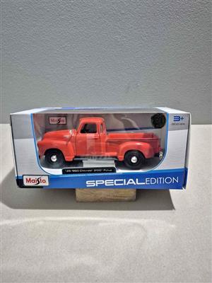 Maisto Special Edition 1/25 scale diecast model of a red 1950 Chevrolet 3100 pickup truck.