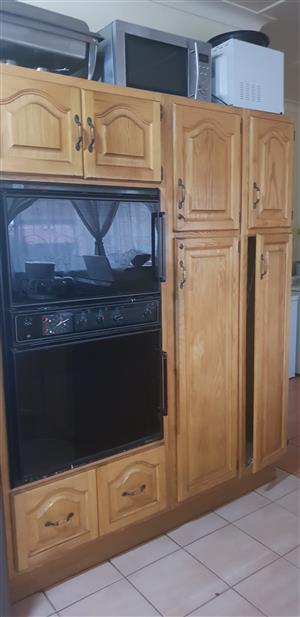 Oak kitchen cupboards with hob and eye level oven for sale. Solid wood doors and frames. In good condition, need new tops.