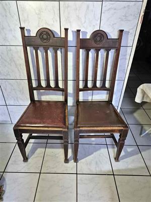 A pair of antique or vintage high-back dining chairs
