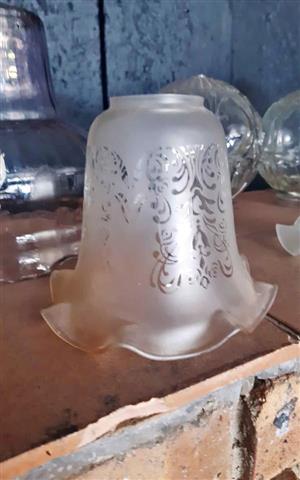 Victorian-style frosted, acid-etched glass lamp shade with a ruffled or frilled edge. 