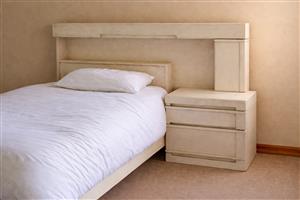 Matching mirror vanity table and bed with extended headboard