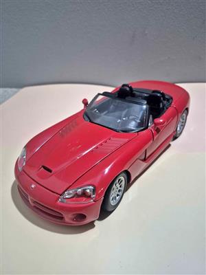1:18 scale model of a red 2003 Dodge Viper SRT-10, produced by manufacturers such as Motor Max