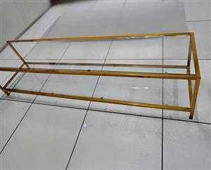Glass TV stand with gold frame