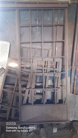 17 steel window frames and 1 sliding door