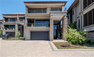 An executive 4 bedroom, 5 bathroom home in secure Izinga Park Estate
