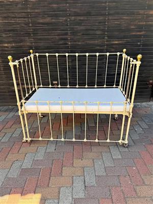 Antique whrongh iron baby cot with copper knobs