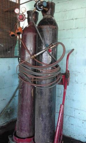 Gas bottles welders with pipes 