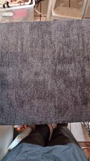 33 grey carpet tiles, used in commercial or residential flooring