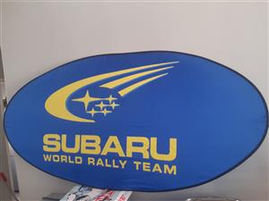 SUBARU LARGE WINDSCREEN SUN PROTECTOR NO BAG.