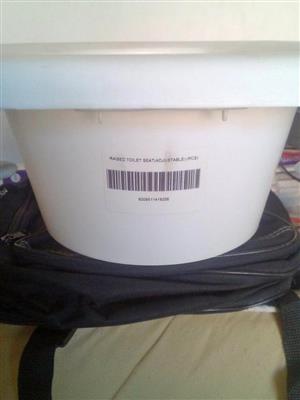 Raised toilet seat (adjustable)