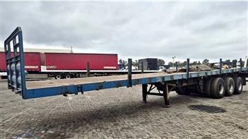 1994 HENRED TRI AXLE FLATDECK.