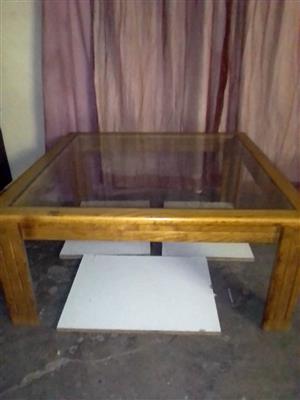 Beautiful simple light brown wooden coffer table with glass top