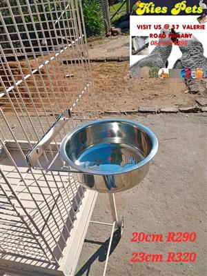 Large stainless steel pet feeding bowls on clamps