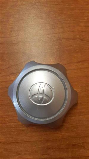 TOYOTA CENTER CAPS A SET. BRAND NEW. FOR VARIOUS OTHER CARS TOO.