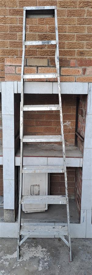 Alluminium 8 Step Ladder. Used one. Back poles missing. R650. I am in Kew, Johan