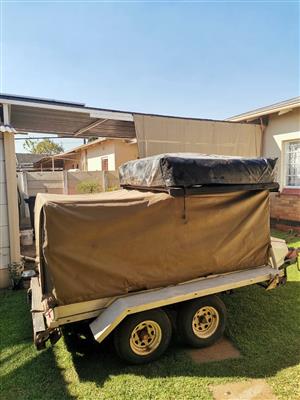 Multitasking camping double axel trailer for sale. License up to date. 
