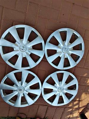 TOYOTA COROLLA, QUANTUM, QUEST, PROFESSIONAL 15" ETC WHEEL CAPS. FOR A SET. BRAND NEW.