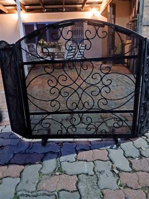 Stunning wrought iron fireplace screen is a 3-panel folding design