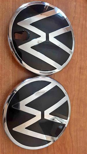 AMAROK GRILL BADGES. BIGGER SIZE. ONE PLAIN,AND ANOTHER WITH A CAMERA SLOT.FOR VARIOUS OTHER CARS.