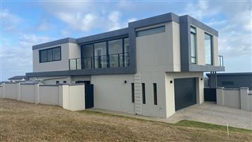 Modern Luxury Meets Endless Horizons: A 4-Bedroom Coastal Masterpiece with Panoramic Sea Views