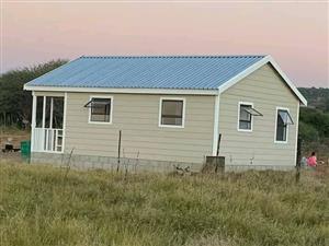 Nutec house and log cabin