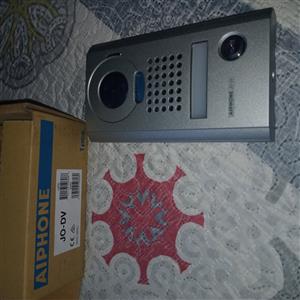 built-in camera, microphone, speaker grille, and call button.