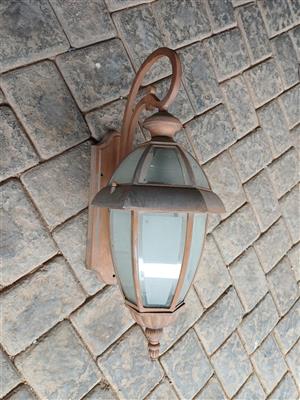 Outdoor vintage bronze wall lantern light fitting.