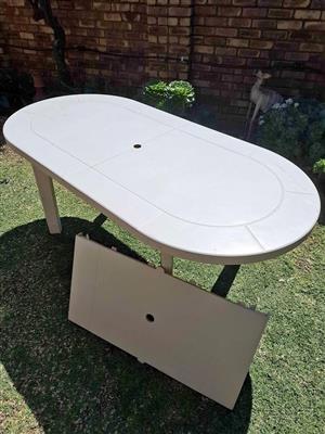 Plastic table (Quality)with extention piece if you want it bigger for sale.