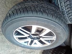 18" Toyota Hilux/Fortuner mag with brand new 265/60/18 Dunlop A/T to use for spare wheel 