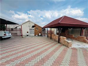 Spacious 4-Bedroom Home with Additional Outside Rooms & Entertainment Area