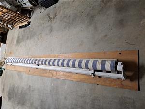 AWNING ROLL OUT Used Grey and White Stripes Wind Out/In with Winder 2.94m x 3m