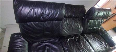 Used black leather lounge 