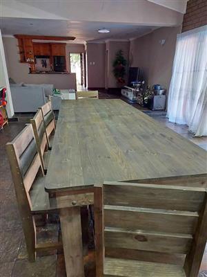 Wooden 10 Seater table and Chairs.