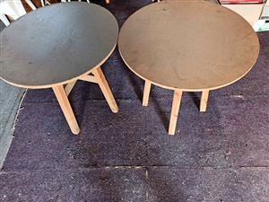 Two wooden round tables