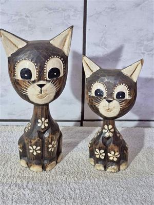 Vintage hand-carved wooden cat figurines, commonly styled as Balinese folk art