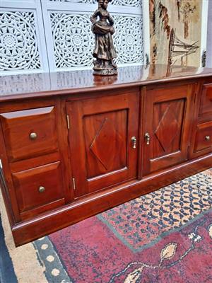 Elegant Wooden Sideboard with Intricate Carved Back Panel