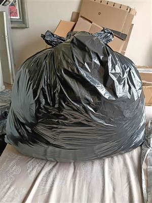 Black bag with ladies ckothing. Sizes small/medium