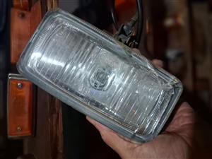 Hella spotlight with bracket, glass cracked