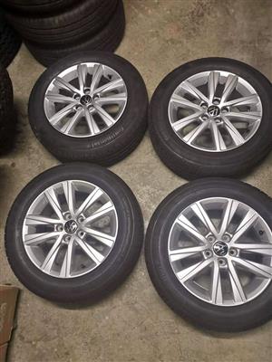 15inch VW Polo Original mags with fairly new 185/60/15 Continental (90%) 