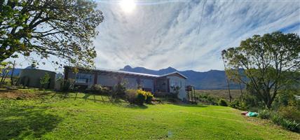 Spacious Family Home with 3 Vacant Plots & Mountain Views